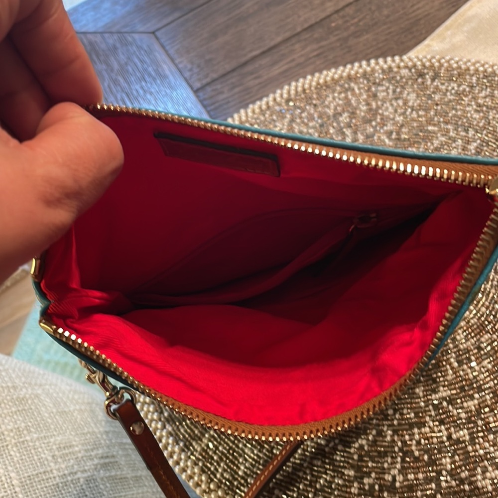 Original dooney &bourke pouchette ..very new condition…used very mildly…